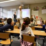Lively classroom scene with students participating acti