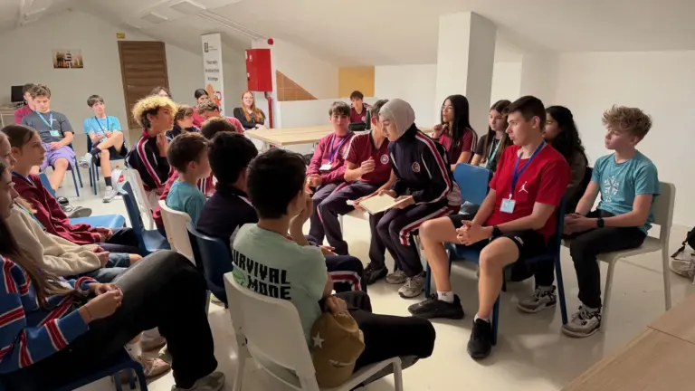 Participants debating in a circle during a faction session