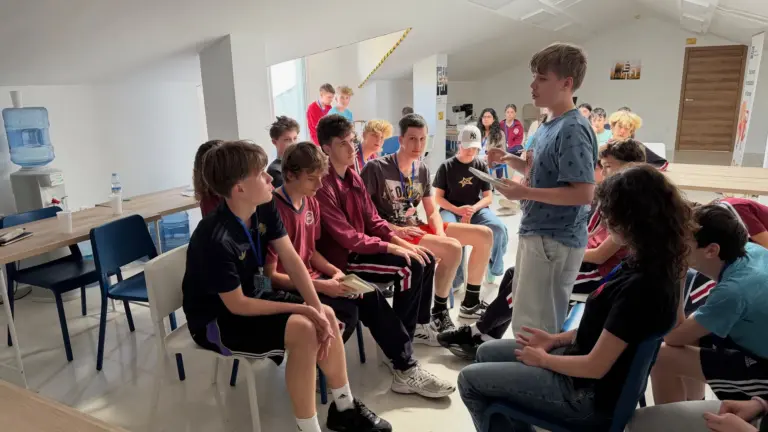 A participant speaking to the group during a take-a-stand exercise