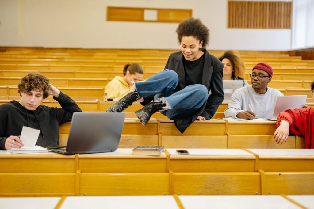 Diverse students interact and study in a university lec