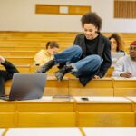 Diverse students interact and study in a university lec